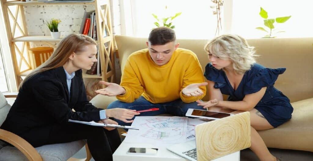 interior designer working with young couple lovely family professional designer architector discussing conept future interior working with colour palette room drawings modern office 155003 34234