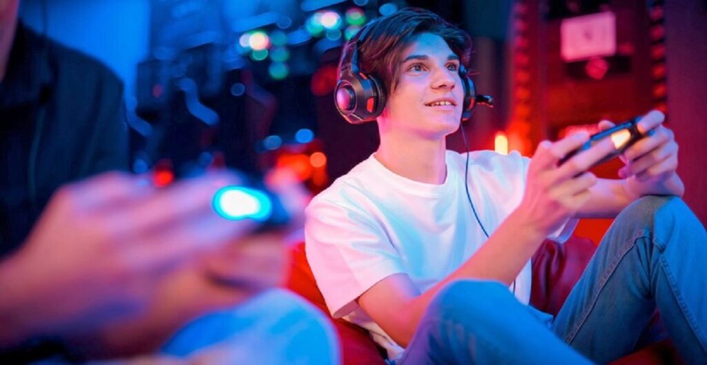 view-smiling-teen-playing-game-console-headphones-using-gamepad_1268-25915-1024x529 Exploring iOS eTrueSports: The Future of Mobile Gaming